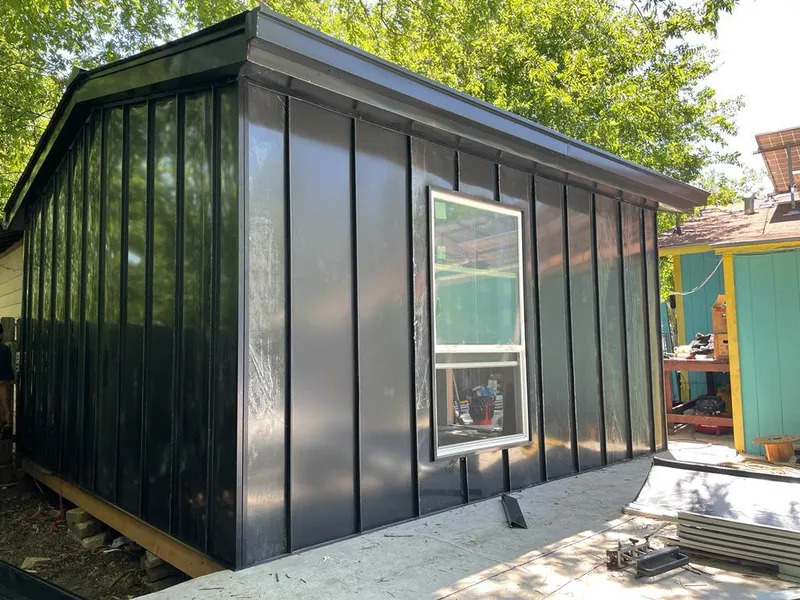 Black standing seam metal wall panels for Roof Inspection in Epping